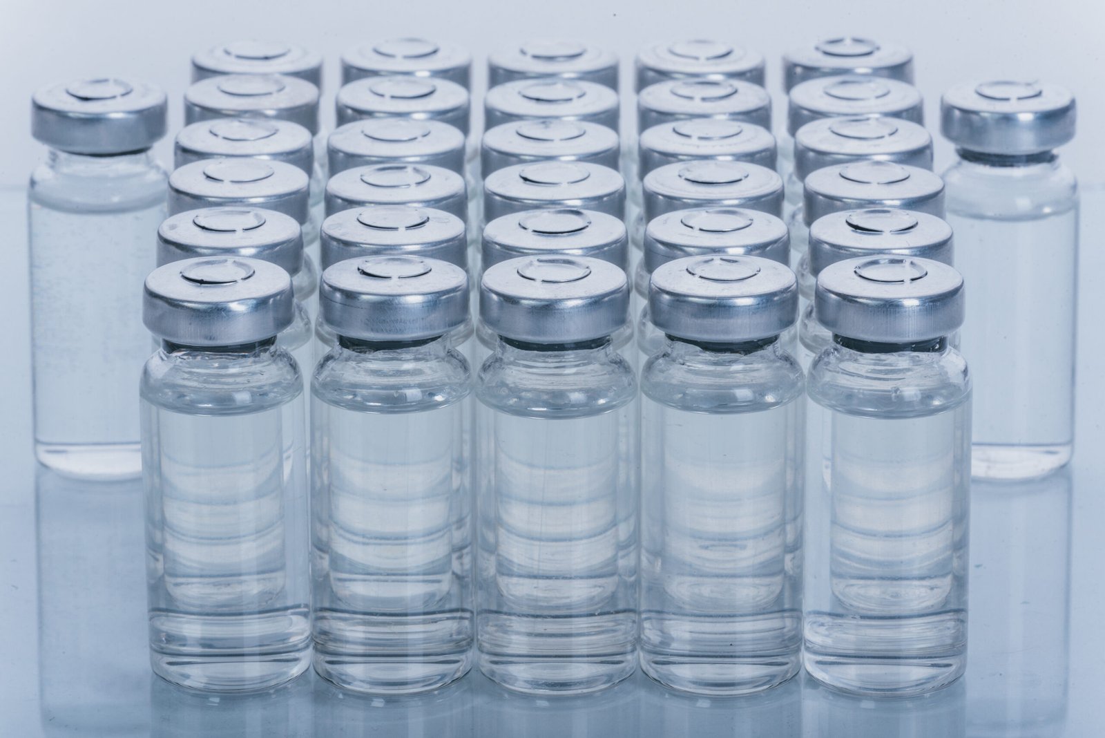 Glass Medical Ampoule Vial For Injection. Medicine Is Dry White Drug Penicillin Powder Or Liquid With Of Aqueous Solution In Ampulla. Close Up.